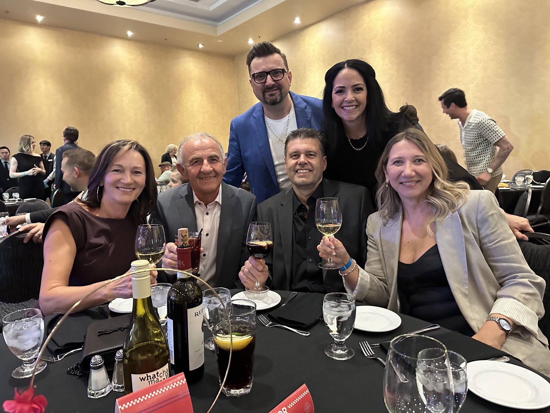 Danijel with friends at a gala dinner